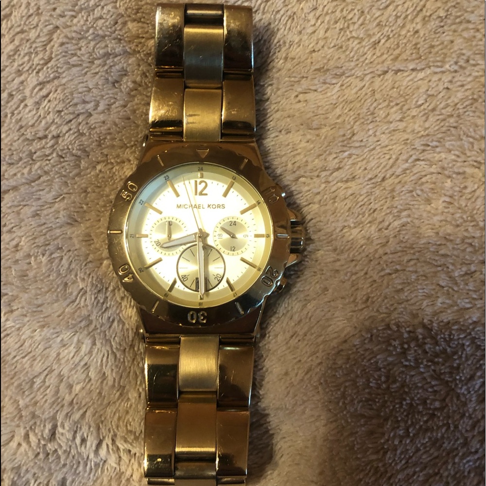 Gold MK big faced watch